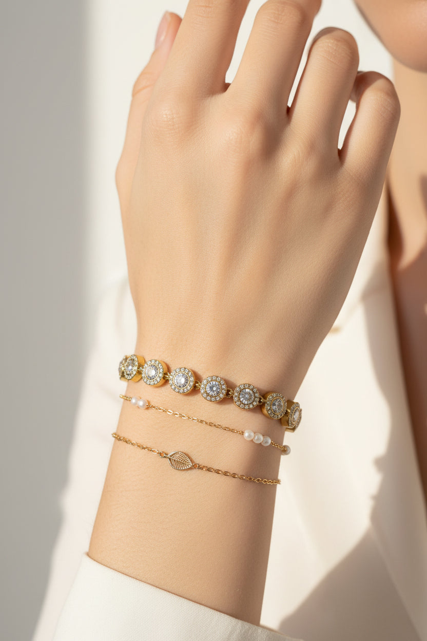 BRACCIALE CON ZIRCONI ROTONDI ORO -ACCIAIO 316L