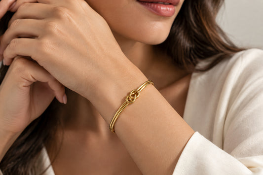 BRACCIALE RIGIDO DORATO -ACCIAIO