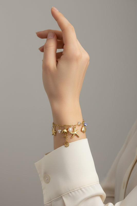 BRACCIALE CON CHARMS MARINI -ACCIAIO 316L +CRISTALLO